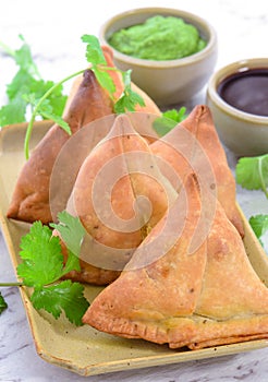 Indian traditional teatime snack - Samosa & chutney