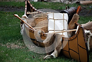 Indian canoe with furs and basket