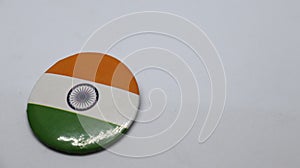 Indian Tricolor placed over a circular object kept isolated on a white