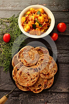 Indian vegan food recipes- wheat paratha with dum aloo.