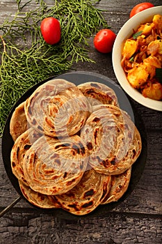 Indian vegan food recipes- wheat paratha with dum aloo.