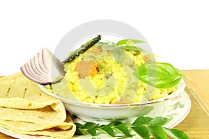Indian vegetable rice -khichdi with tortilla bread roti or naan