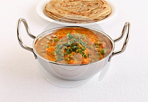 Indian Vegetarian Food Peas and Carrot Curry in a Steel Wok