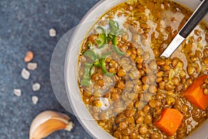 Indian vegetarian lentil soup, mung dal. Indian food spice concept. Dark background, top view. Vegan Healthy Food Concept, macro