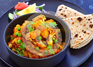 Indian vegetarian meal-Cauliflower Curry with roti photo