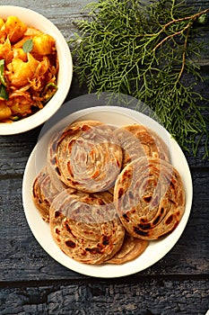 Indian vegetarian recipes- - wheat paratha with dum aloo.