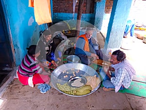 Indian village cooks making floar meal for occasion at home in india dec 2019