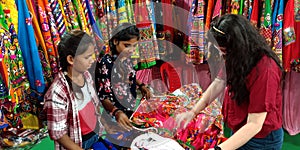 indian village girls buying traditional outfits during festival season in India