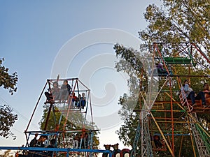 indian village people enjoying swing at local fair program in India January 2020