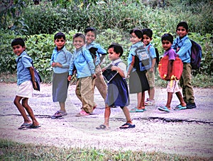 Indian village school children smiling and laughing going school poor kids of India in happy mood mid day meal right to education