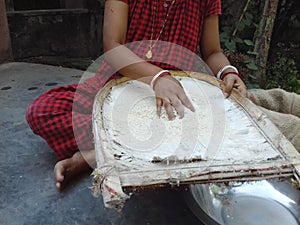 Indian Village Women Style Rice Cleaning Bamboo Kula . photo