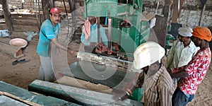 Indian village worker on the job at sawmill