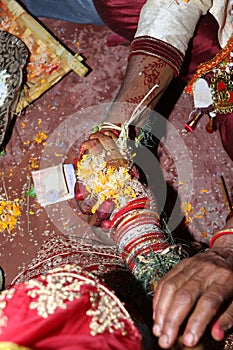 Indian wedding . bride and groom promise to hold .jpg