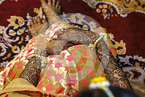 Indian wedding ceremony : bangle in bridal hand with mehandi design