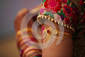 Indian wedding ceremony : bangle in bridal hand with mehandi design