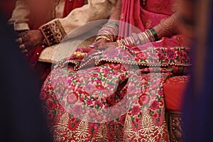 Indian wedding ceremony : bangle in bridal hand with mehandi design