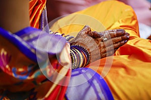 Indian wedding ceremony: bridal hand in haldi ceremony