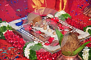 Indian Wedding Ceremony Bride and Groom taking seven oaths with seven rounds around Fire