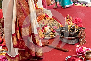 Indian wedding ceremony, decorations for traditional ethnic rituals for marriage, fire burning, flowers and statuettes of the