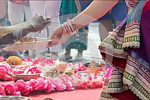 Indian wedding ceremony, decorations for traditional ethnic rituals for marriage, fire burning, flowers and statuettes of the