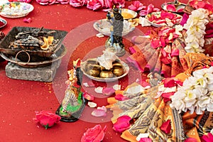 Indian wedding ceremony, decorations for traditional ethnic rituals for marriage, fire burning, flowers and statuettes of the