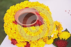 Indian wedding prayer items for thread ceremony, pooja Puja, focused on center of clay pot