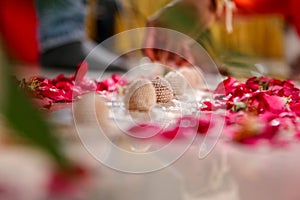 Indian wedding ritual, Maharashtrian Saptapadi on rose petales spread on floor