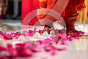 Indian wedding ritual, Maharashtrian Saptapadi on rose petales spread on floor