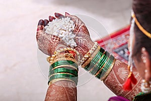 Indian wedding ritual, Maharashtrian Saptapadi on rose petals spread on floor