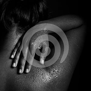 Indian woman back hand water drops black and white