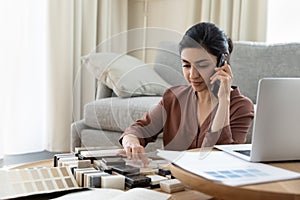 Indian woman consult client over tablet sample choice