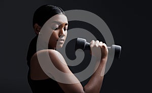 Indian woman, dumbbells and exercise in studio for training on black background, lose weight or mockup. Female person