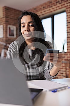 Indian woman making purchase online