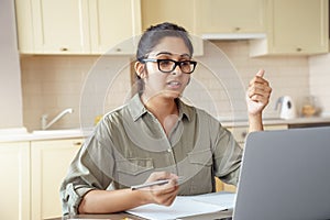 Indian woman online school teacher explaining online class video call.