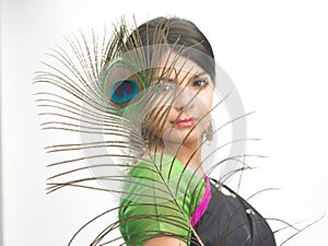 Indian woman with peacock feather