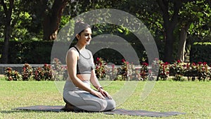 An Indian woman performs the vajrasana pose in this video.