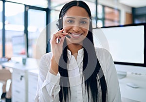 Indian woman, portrait and headset for telemarketing at call centre with computer screen, mockup or customer support