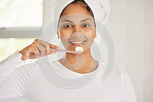 Indian woman, portrait and toothbrush for brushing teeth with smile for cleaning, morning or whitening. Female person