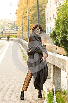 Indian woman posing in an urban context