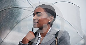 Indian woman, rain and waiting with umbrella for transport, business trip or commute to work in winter. Female person or