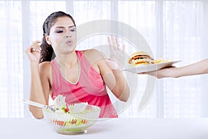 Indian woman saying no to junk food