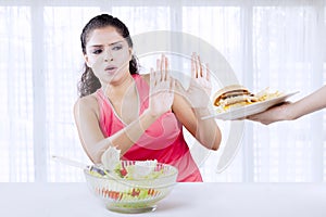 Indian woman saying no to junk food