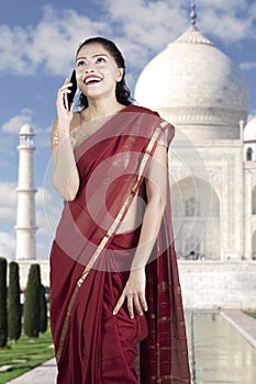 Indian woman speaking on smartphone