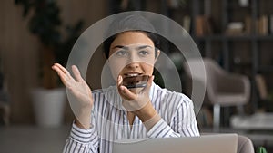 Indian woman talk on loudspeaker on smartphone