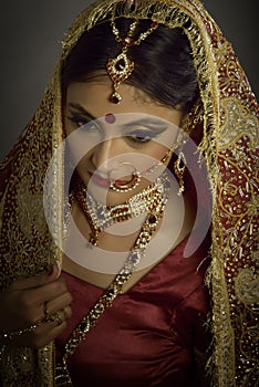 Indian woman with traditional bridal make-up and jewelry