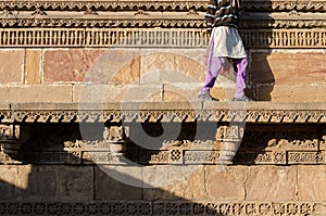 Indian woman walking on beautiful border patterns & designs engr