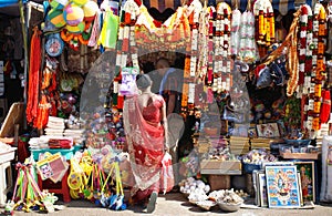 Indian woman watching religious articles