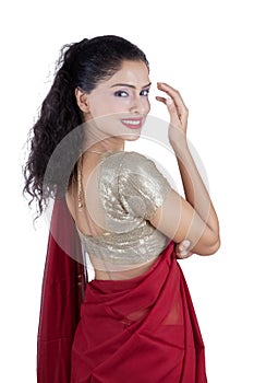 Indian woman wearing sari clothes on studio