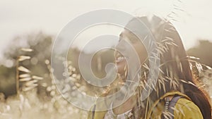 Indian woman, wheat plants and calm person in nature feeling peace from holiday and freedom. Female on summer travel