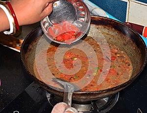 Indian women cooking Indian dish